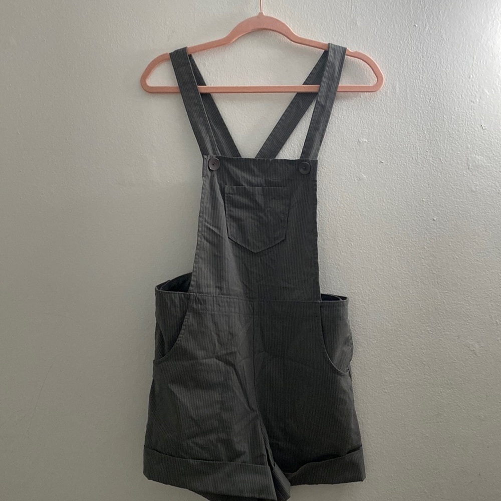 Striped overall short, low back. Never worn, US size 6